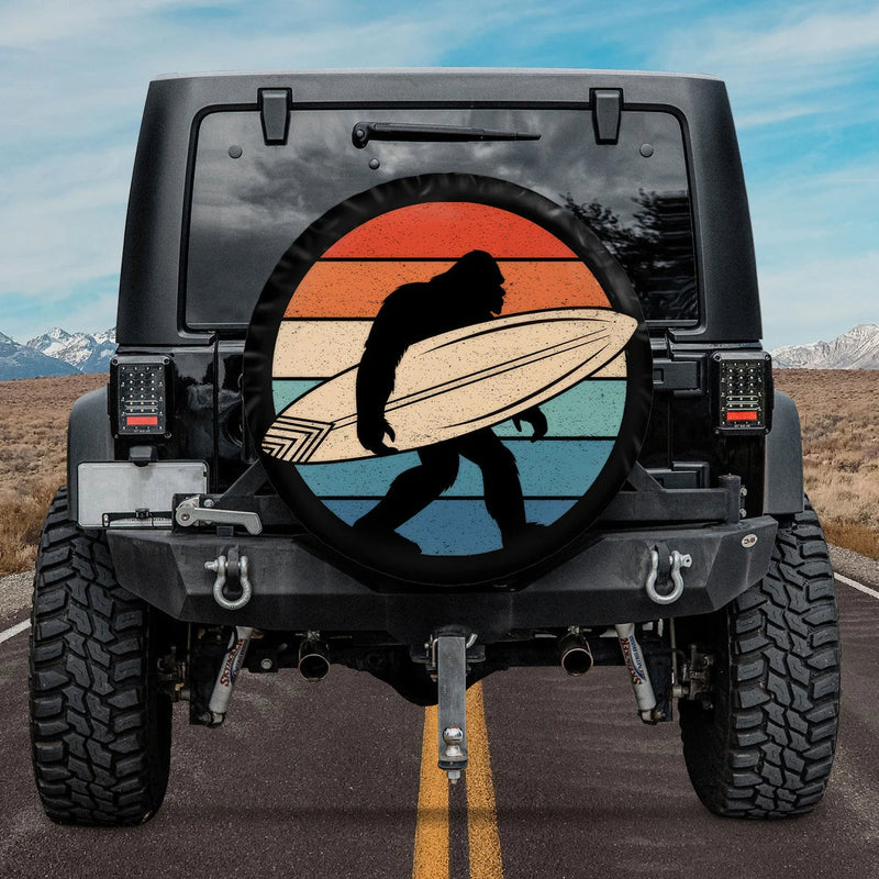 Load image into Gallery viewer, Surfing Bigfoot Sunset Spare Tire Cover
