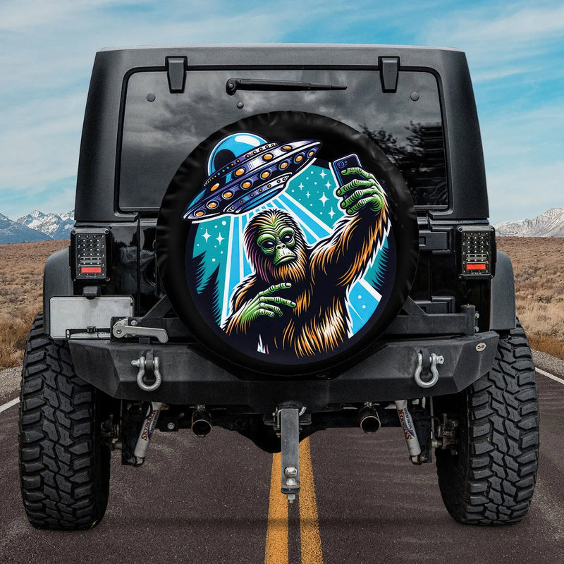 Load image into Gallery viewer, Bigfoot Selfie With Alien UFO Spare Tire Cover
